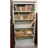 A grey distress-painted open bookcase