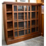 An early 20th century Arts and Crafts oak bookcase