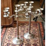 A pair of steel four-branch candelabra