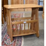 An Ercol elm Chaucer magazing rack