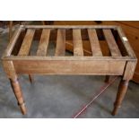 An early 20th century oak luggage rack