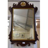A 19th century mahogany framed fret cut wall mirror with gilt detailing