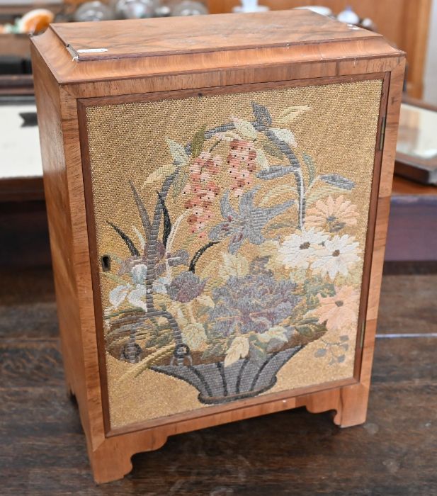 A walnut table-top cabinet,