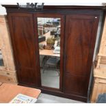 A large mahogany wardrobe