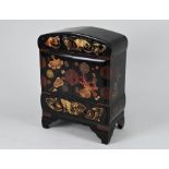 An early 20th century Japanese black lacquered table top cabinet (ko-dansu)