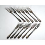 A late Victorian heavy quality set of twelve three-tine dessert forks