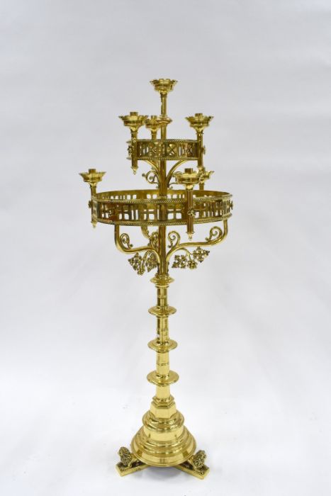 A Victorian Gothic Revival floor standing brass candle luminaire
