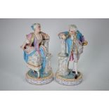 A pair of French painted bisque figures of 18th century couple