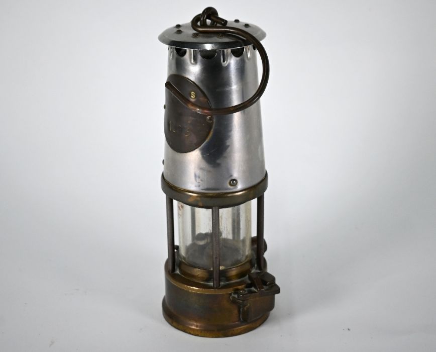 A vintage miner's lamp (maker's plate obscured)