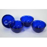 A set of four Chinese monochrome blue Peking glass bowls