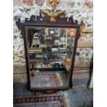 A large early 19th century fret cut mahogany wall mirror