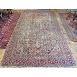 An old Persian Hamadan kelleigh carpet, the worn red ground with diamond central lozenge