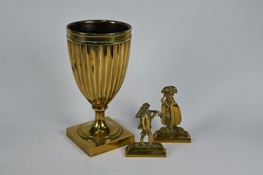 A Georgian brass fluted urn in the Adam style