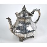 A Victorian silver teapot of octagonal pear-shape