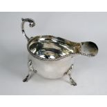 A heavy quality silver pot-bellied sauce-boat