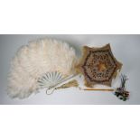 A 19th century parasol, various fans and hat-decorations