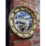 A small Victorian giltwood and composite convex mirror