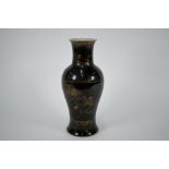 An 18th century Chinese mirror-black (wujin) baluster vase with gilded decoration, Kangxi period (16