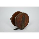 An antique teak and brass 3" fishing reel by Alcock & Co Ltd