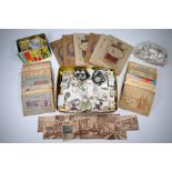 A selection of cigarette card albums and loose cigarette and trade cards