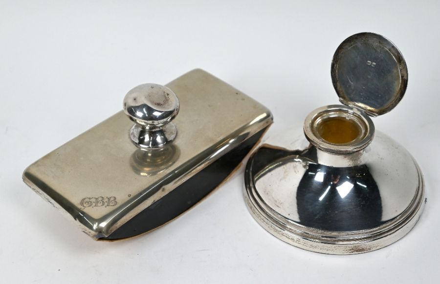 A silver capstan inkwell and a German rocker-blotter