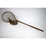 A vintage split-cane three-piece 9ft fly rod and landing net