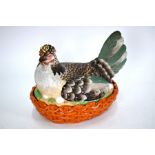 A 19th century painted bisque 'Hen in basket' egg-holder