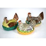 Three 19th century painted bisque 'Hen in basket' egg-holders