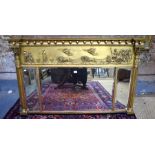 A late Regency giltwood and composition triptych over mantel mirror