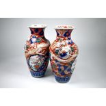 A pair of Japanese Imari dragon baluster vases, Meiji period