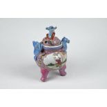 A Chinese porcelain famille rose tripod incense burner and cover