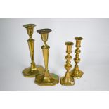 Two pairs of 19th century brass baluster candlesticks