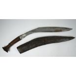 A Gurkha kukri with 46 cm curved blade and carved wood handle