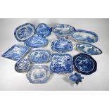 Fourteen various early 19th century pottery and ironstone blue and white serving dishesFourteen vari