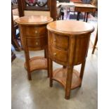 A pair of John Lewis walnut circular bedside tables/lamp tables