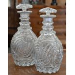A pair of 19th century pressed and cut glass ovoid decanters