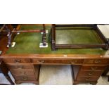 A large mahogany twin pedestal desk