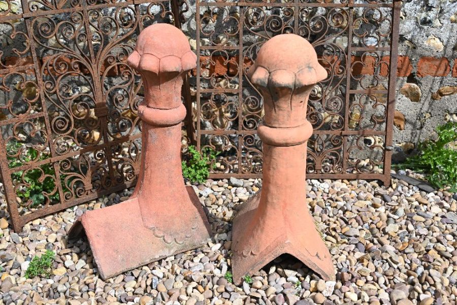 A pair of reconstituted stone Victorian style ball finial ridge tiles