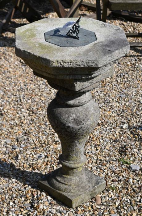 A cast weathered stone garden sundial, 73 cm high