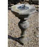 A cast weathered stone garden sundial, 73 cm high