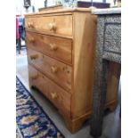 An antique pine chest of two short over three long drawers