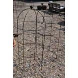 A pair of weathered steel ball head garden obelisks, 135 cm x 60 cm