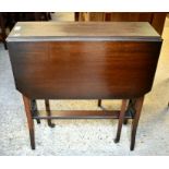 An Edwardian walnut Sutherland table