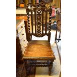 A 19th century carved oak Gothic revival side chair with barleytwist supports