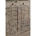 A trio of weathered steel ball head garden obelisks, 116 cm x 42 cm