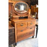 An Edwardian mirror-backed dressing chest