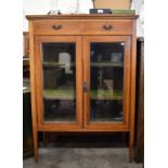 An Edwardian walnut crossbanded display cabinet