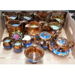 Ten various copper lustre jugs