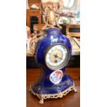 A French ceramic blue glazed and gilt metal mounted mantel clock,