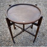 An Arts & Crafts style circular oak games table